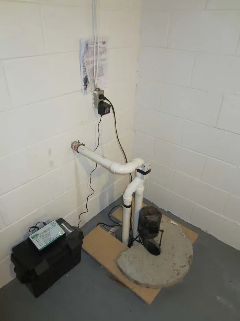 sump pump installed in concrete floor