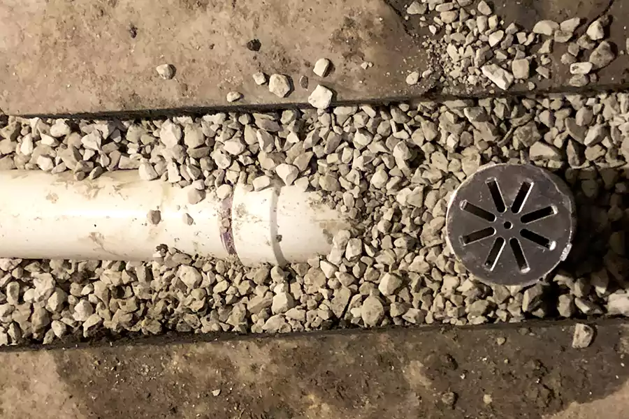 a sump pit that will trap water and drains to the main sewer line connects to this basement drain