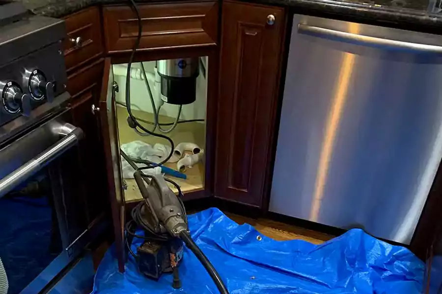 standing water in a sink drain led to this complete garbage disposal replacement