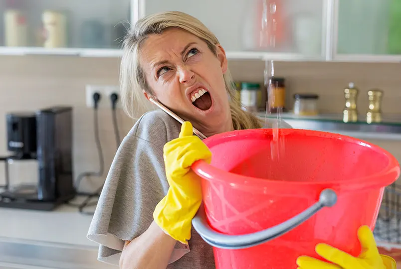 Rescue-plumbing-women-with-bucket-catching-water-leak
