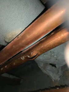 Water leaks from burst pipe