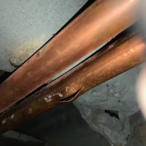 Water leaks from burst pipe