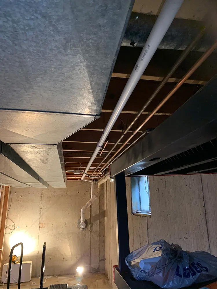 basement with overhead sewer system