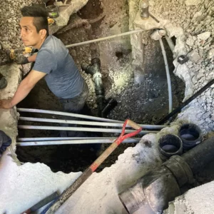 Friendly staff repairs sewer