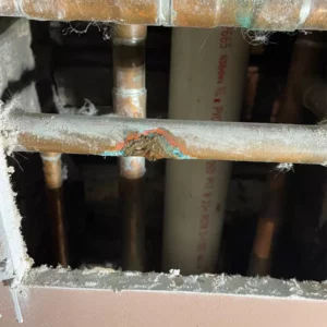 damaged pipe flooding the ceiling