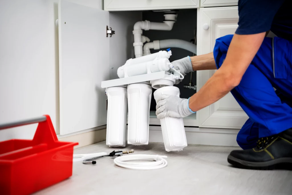 Water filter installation by a professional plumber