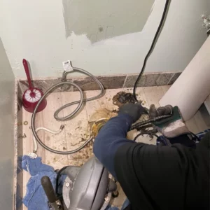 Rescue Plumbing plumber locate clog in basement bathroom