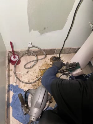 Rescue Plumbing plumber locate clog in basement bathroom