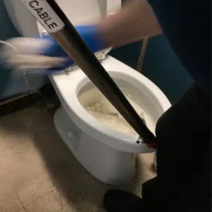 Commercial auger efficiently used in plumbing and sewer service for clogged toilet