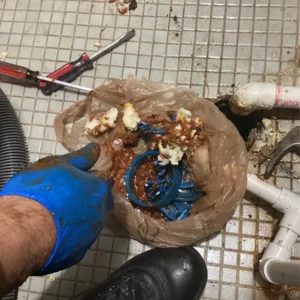 Close up of clogged drains from drain cleaning in illinois