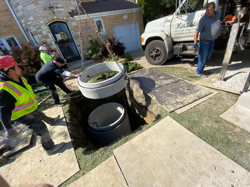 professional plumbers installing flood control system 