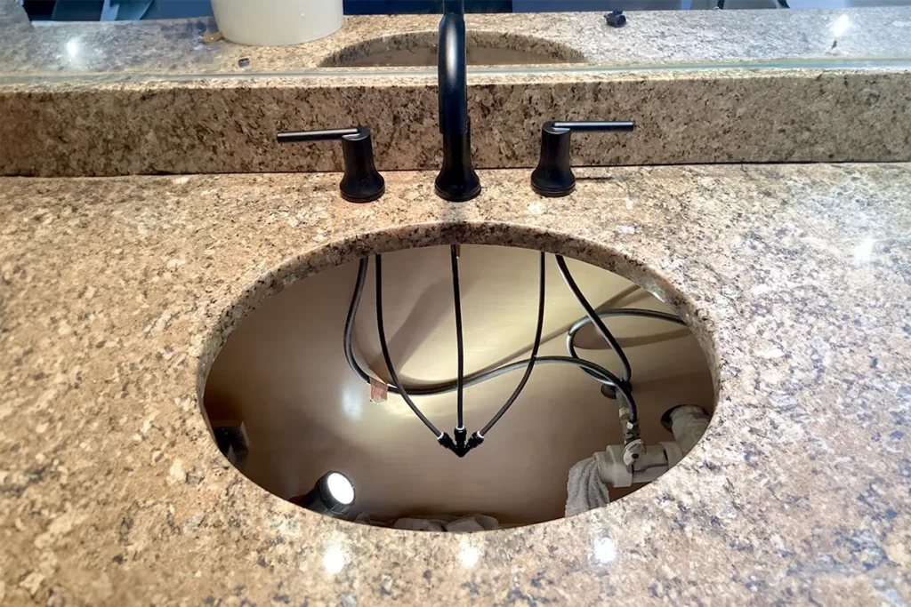 Certified plumber repair sinks in customers home