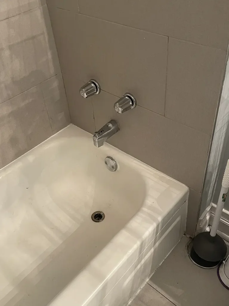 two handles in bathroom shower 