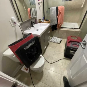 Water damage drying in residential bathroom performed by highly trained restoration industry