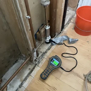 Water damage cleanup using moisture meter