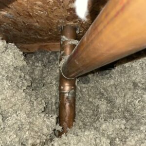 A burst pipe causing potential water damage.