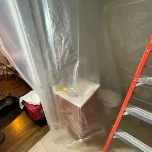Containing the work area to protect the property.