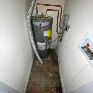 Assessing water damage from a leaking water heater.