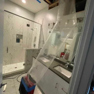 Specialized equipment targeting ceiling for damage restoration.
